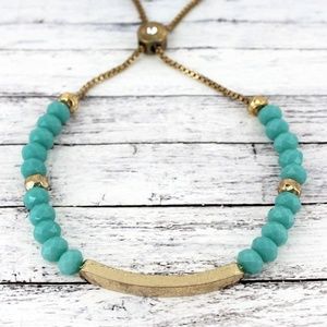 TURQUOISE FACETED BEAD & GOLDTONE BAR BOLO